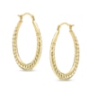 Thumbnail Image 1 of Ribbed Oval Hoop Earrings in Hollow 14K Gold