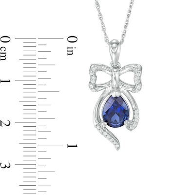 Pear-Shaped Lab-Created Blue Sapphire and 0.09 CT. T.W. Diamond Bow Pendant in Sterling Silver