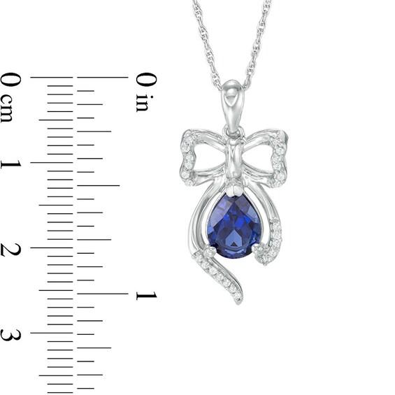 Pear-Shaped Lab-Created Blue Sapphire and 0.09 CT. T.W. Diamond Bow Pendant in Sterling Silver