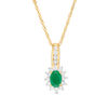 Oval Emerald and 0.25 CT. T.W. Diamond Sunburst Frame Pendant in 10K Gold