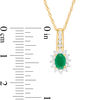 Thumbnail Image 2 of Oval Emerald and 0.25 CT. T.W. Diamond Sunburst Frame Pendant in 10K Gold