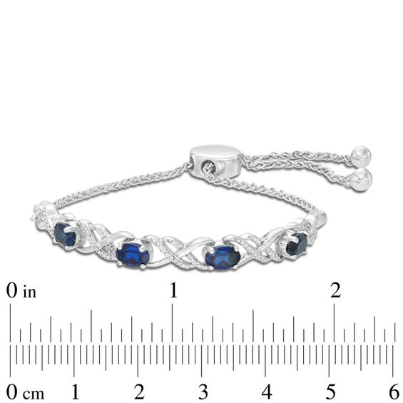 Oval Lab-Created Blue Sapphire and 0.09 CT. T.W. Diamond Infinity Bolo Bracelet in Sterling Silver - 9.5"