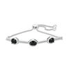 Thumbnail Image 0 of Oval Onyx and 0.09 CT. T.W. Diamond Three Stone Bar Bolo Bracelet in Sterling Silver - 9.5"