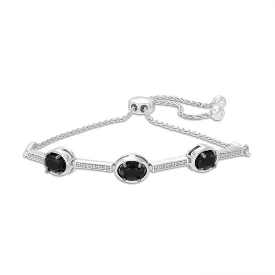 Oval Onyx and 0.09 CT. T.W. Diamond Three Stone Bar Bolo Bracelet in Sterling Silver - 9.5"