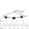 Thumbnail Image 1 of Oval Onyx and 0.09 CT. T.W. Diamond Three Stone Bar Bolo Bracelet in Sterling Silver - 9.5"