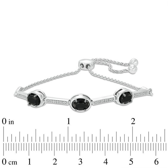 Oval Onyx and 0.09 CT. T.W. Diamond Three Stone Bar Bolo Bracelet in Sterling Silver - 9.5"