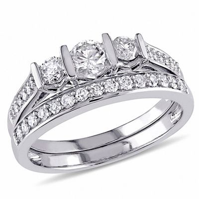 0.73 CT. T.W. Diamond Three Stone Bridal Set in 10K White Gold