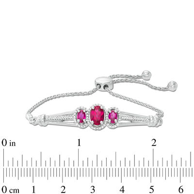 Oval Lab-Created Ruby and 0.18 CT. T.W. Diamond Three Stone Bolo Bracelet in Sterling Silver - 9.5"