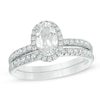 Thumbnail Image 0 of Oval Lab-Created White Sapphire Frame Bridal Set in Sterling Silver