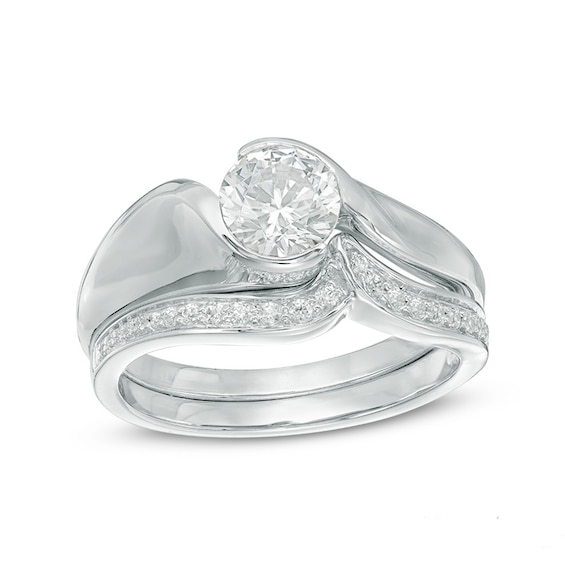 0.87 CT. T.W. Certified Canadian Diamond Swirl Bypass Bridal Set in 14K White Gold (I/I1)