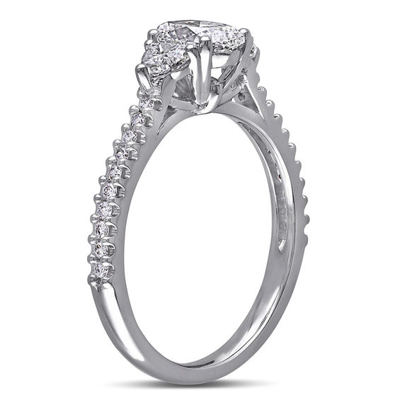 1.09 CT. T.W. Oval Diamond Three Stone Engagement Ring in 14K White Gold