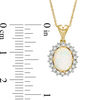 Oval Lab-Created Opal and White Sapphire Sunburst Frame Pendant in 10K Gold