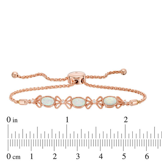 Lab-Created Opal and White Sapphire Bow Bolo Bracelet in Sterling Silver with 18K Rose Gold Plate - 9.0"