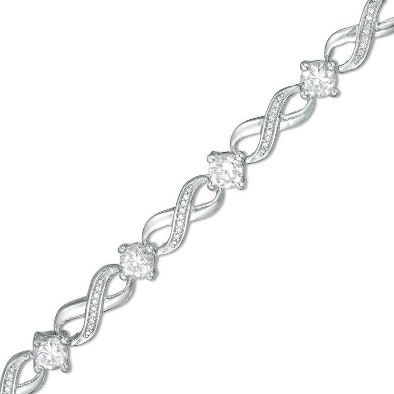 Lab-Created White Sapphire and 0.15 CT. T.W. Diamond Infinity Bracelet in Sterling Silver - 7.25"|Peoples Jewellers