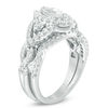 1.45 CT. T.W. Marquise Diamond Frame Twist Bridal Set in 10K White Gold