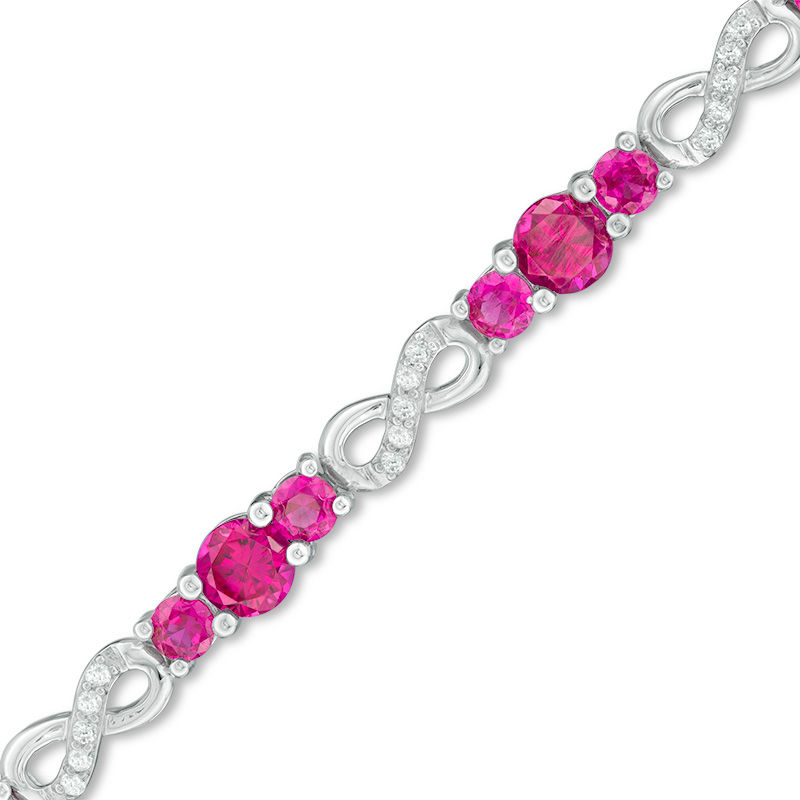 Lab-Created Ruby and White Sapphire Three Stone Infinity Bracelet in Sterling Silver - 7.5"