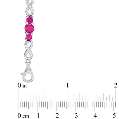 Lab-Created Ruby and White Sapphire Three Stone Infinity Bracelet in Sterling Silver - 7.5"