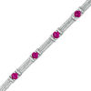 Lab-Created Ruby and 0.45 CT. T.W. Diamond Station Bracelet in Sterling Silver - 7.5"