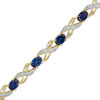 Oval Lab-Created Blue Sapphire and Diamond Accent "XO" Bracelet in 10K Gold