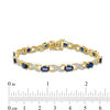 Oval Lab-Created Blue Sapphire and Diamond Accent "XO" Bracelet in 10K Gold