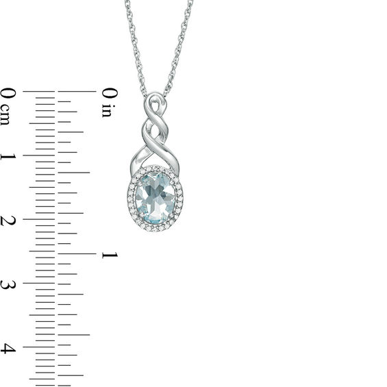 Oval Aquamarine and Diamond Accent Frame Twist Pendant in Sterling Silver