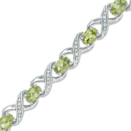 Oval Peridot and 0.11 CT. T.W. Diamond &quot;XO&quot; Bracelet in Sterling Silver - 7.25&quot;