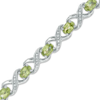 Oval Peridot and 0.11 CT. T.W. Diamond "XO" Bracelet in Sterling Silver - 7.25"