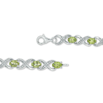 Oval Peridot and 0.11 CT. T.W. Diamond "XO" Bracelet in Sterling Silver - 7.25"