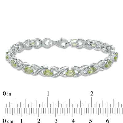 Oval Peridot and 0.11 CT. T.W. Diamond "XO" Bracelet in Sterling Silver - 7.25"