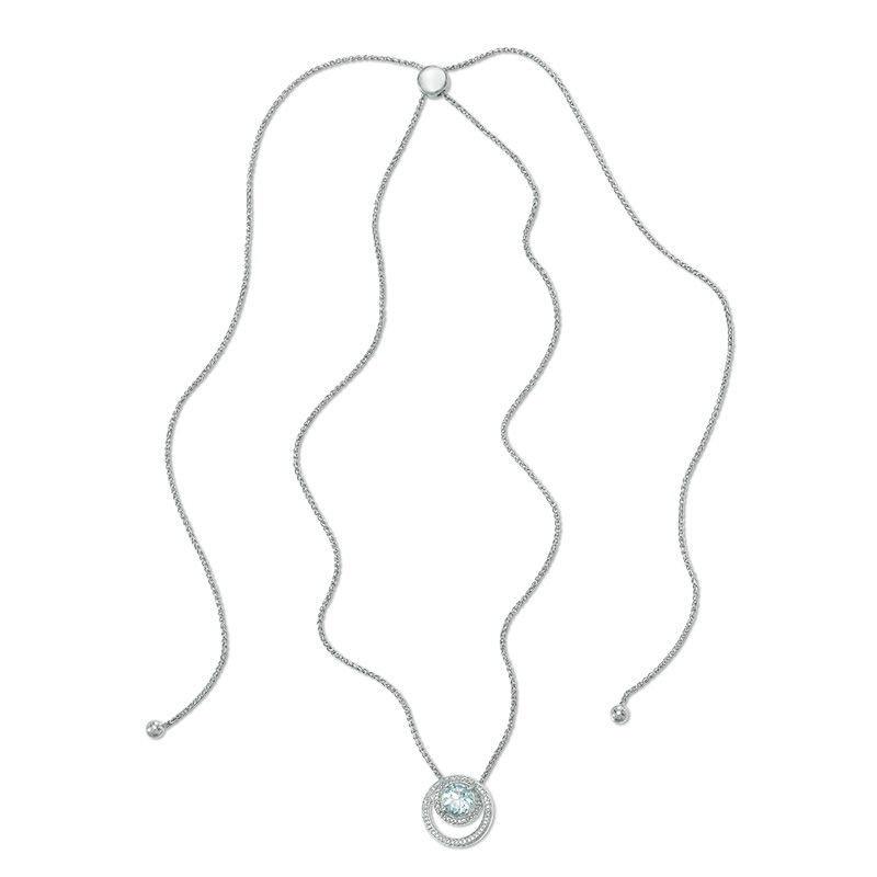 7.5mm Aquamarine and 0.09 CT. T.W. Diamond Swirling Frame Bolo Pendant in Sterling Silver - 30"|Peoples Jewellers