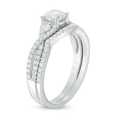 0.88 CT. T.W. Certified Canadian Diamond Twist Bridal Set in Platinum (H/VS2)