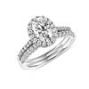 0.77 CT. T.W. Oval Diamond Frame Bridal Set in 14K White Gold