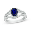 Thumbnail Image 0 of Oval Lab-Created Blue Sapphire and 0.18 CT. T.W. Diamond Split Shank Ring in Sterling Silver