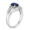 Thumbnail Image 1 of Oval Lab-Created Blue Sapphire and 0.18 CT. T.W. Diamond Split Shank Ring in Sterling Silver