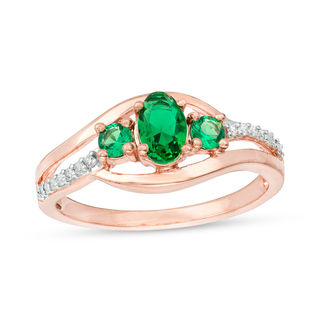 Oval Lab-Created Emerald and 0.04 CT. T.W. Diamond Three Stone Bypass Engagement Ring in 10K Rose Gold