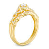 0.37 CT. T.W. Diamond Frame Twist Bridal Set in 10K Gold