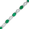 Thumbnail Image 0 of Oval Lab-Created Emerald and 0.46 CT. T.W. Diamond "O" Bracelet in Sterling Silver - 7.5"