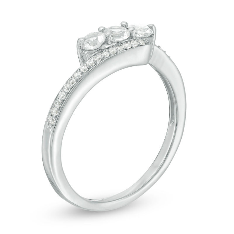 Lab-Created White Sapphire and 0.15 CT. T.W. Diamond Three Stone Bypass Ring in Sterling Silver