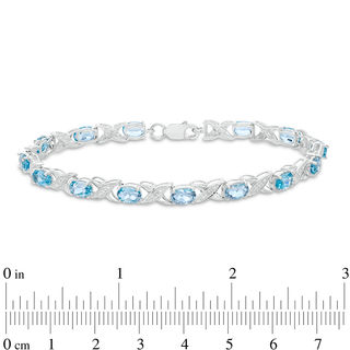 Sideways Oval Swiss Blue Topaz and Diamond Accent "XO" Bracelet in Sterling Silver - 7.25"