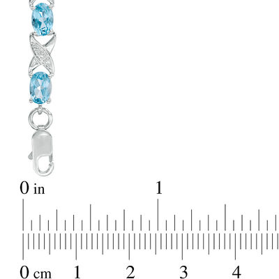 Sideways Oval Swiss Blue Topaz and Diamond Accent "XO" Bracelet in Sterling Silver - 7.25"