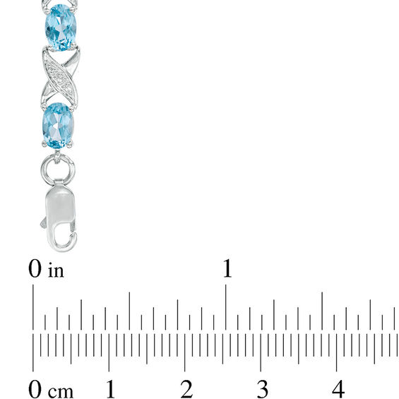 Sideways Oval Swiss Blue Topaz and Diamond Accent "XO" Bracelet in Sterling Silver - 7.25"