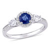 Blue and White Sapphire and 0.12 CT. T.W. Diamond Frame Three Stone Engagement Ring in 14K White Gold