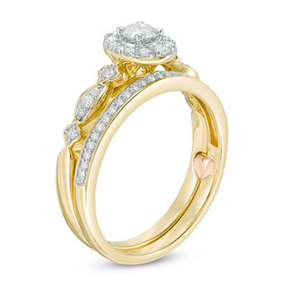 Perfect Fit 0.45 CT. T.W. Diamond Oval Frame Interlocking Bridal Set in 10K Gold