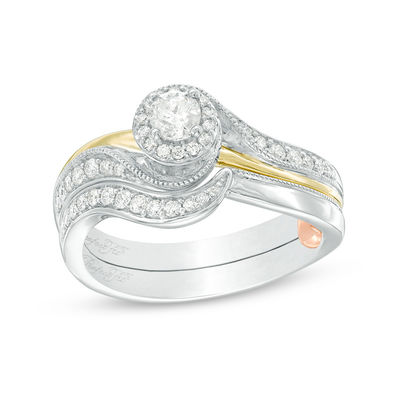 0.40 CT. T.W. Diamond Swirl Bypass Interlocking Bridal Set in 10K Two-Tone Gold