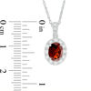 Thumbnail Image 1 of Oval Garnet and Lab-Created White Sapphire Frame Vintage-Style Pendant in Sterling Silver