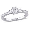 0.61 CT. T.W. Oval and Pear-Shaped Diamond Three Stone Engagement Ring in 14K White Gold