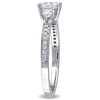 0.61 CT. T.W. Oval and Pear-Shaped Diamond Three Stone Engagement Ring in 14K White Gold