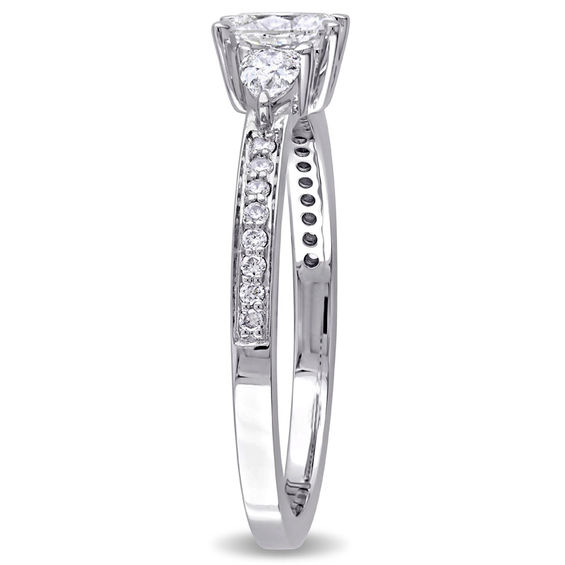 0.61 CT. T.W. Oval and Pear-Shaped Diamond Three Stone Engagement Ring in 14K White Gold