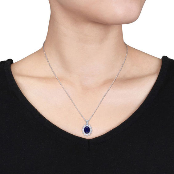 Oval Lab-Created Blue and White Sapphire Sunburst Frame Pendant in Sterling Silver with Diamond Accents