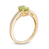 Oval Peridot and 0.116 CT. T.W. Diamond Double Row Ring in 14K Gold